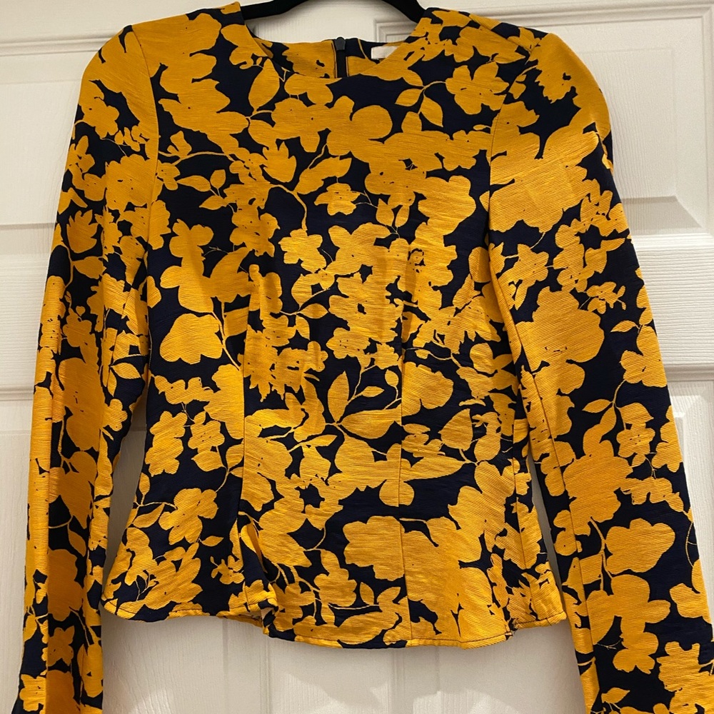 H&M black and gold dress with slight peplum.